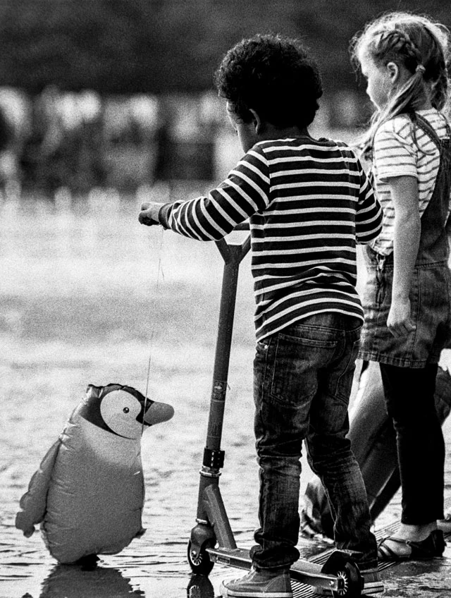 A penguin and kids