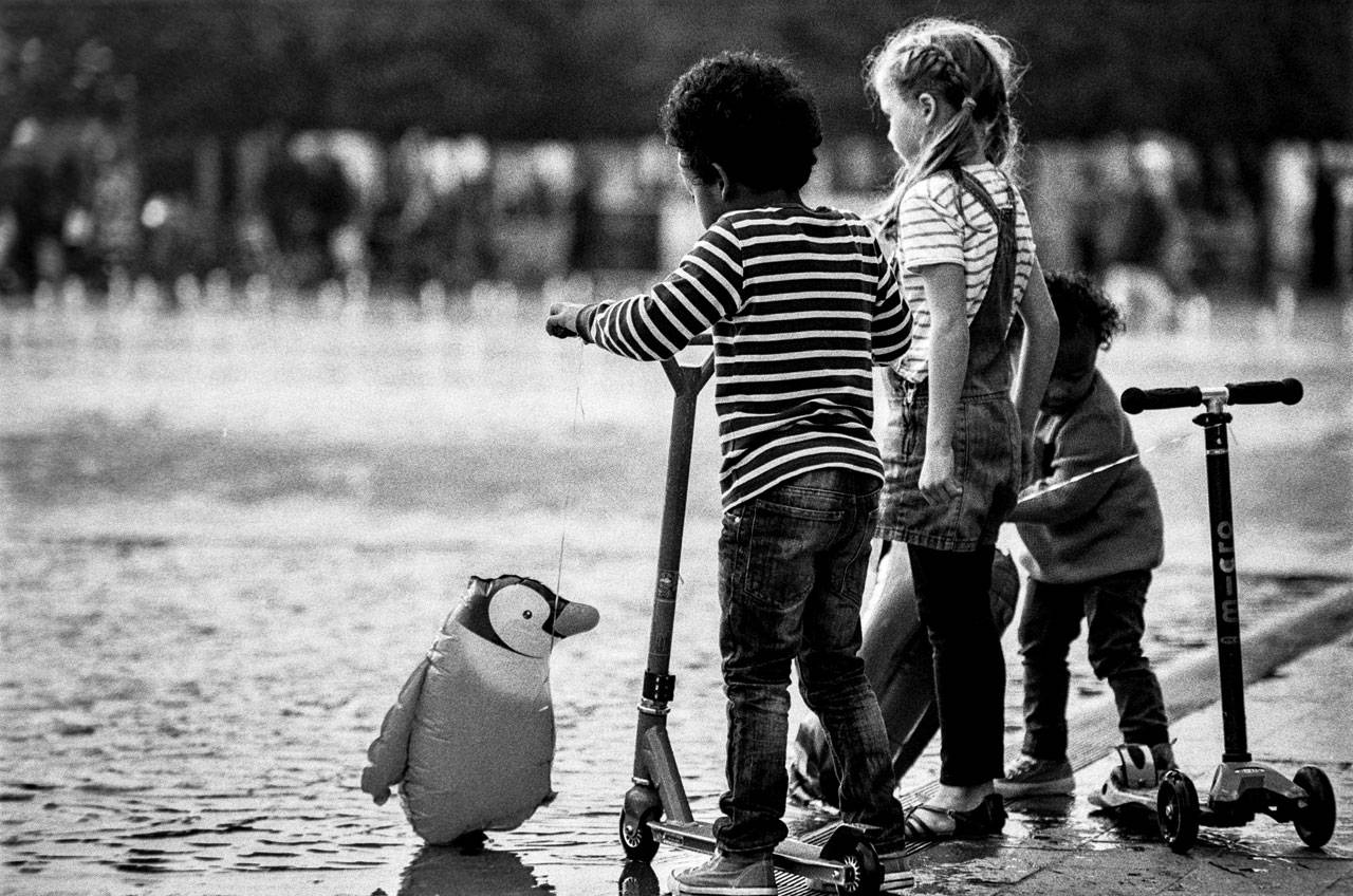 A penguin and kids